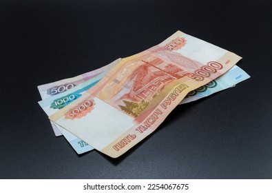 money of different naminals on a dark background - Shutterstock ID 2254067675