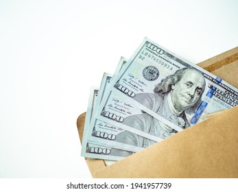 Money In Envelope On White Background. Cash In Envelope. Dollar Bill. USA Dollars. USD. Savings Concept. Bribery And Corruption Theme. Bribe In Envelope. Money As A Gift.