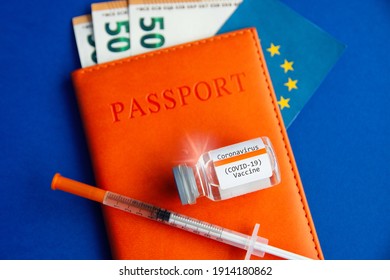 money euro banknotes passport, syringe and vaccine  international certificate of vaccination during coronavirus pandemic, vaccine availability in rich and poor countries. sale of medicines. 