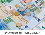 Money euro coins and banknotes in studio on white background.