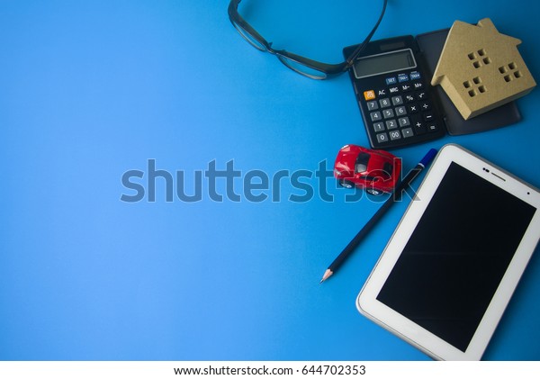 money finance\
with office tools on blue\
ground