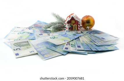 Money As A Gift For The New Year And Christmas On A White Background. An Isolated Image.