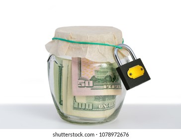 Money In A Glass Jar, Dollars, Savings Under Lock And Key, The Conceptual Idea Of Keeping Cash