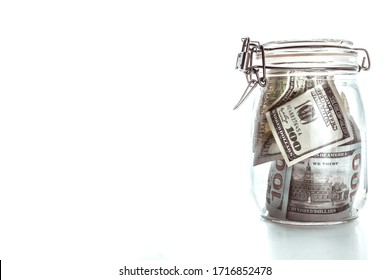 Money In A Glass Jar, Dollars, Savings Under Lock And Key, The Conceptual Idea Of Keeping Cash