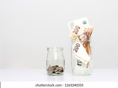 Money In A Glass Jar Sitting On The Table No People Stock Photo