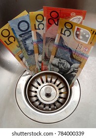 clipart of money going down the drain