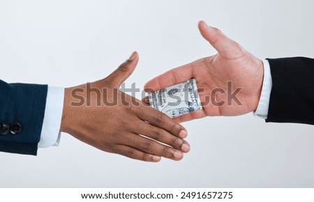 Money, handshake and business people for deal in studio for theft, bribery and finance corruption. Corporate, cash and workers shaking hands for secret payment, blackmail and fraud on gray background