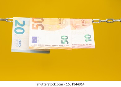 Money Held In A Chain Or Hung On A Chain; Paper Money Legal Tender; Euros, Currency Of The European Economic Community, Common Market.