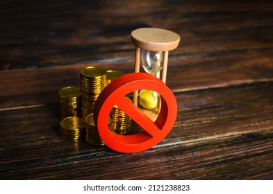 Money and hourglass under the prohibition sign. Sanctions and restrictions. Confiscation of capital of illegal origin. Freezing of assets, seizure of savings. Economic embargo. Loan disapproval.
