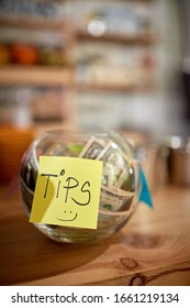 Money In The Jar. Tips For A Friendly Employee In Coffee Shop.