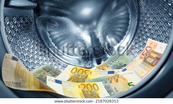 Money\
laundering. Many euro banknotes in washing\
machine