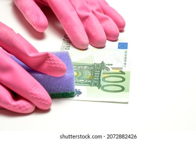 Money laundering in offshore and criminal capitals. The concept of anti laundering money ALM. 100 (hundred) euro, glowes and dishwash in a white background. High quality photo