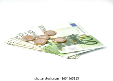 Money laundering on clothesline on light background. 100 eur notes. Banknotes and coins at white background