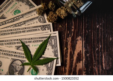 Money Marijuana Dollar bill and Medical Marijauna on Table CBD THC