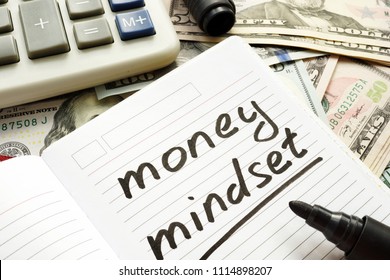 Money Mindset Handwritten In A Note And Dollar Banknotes.