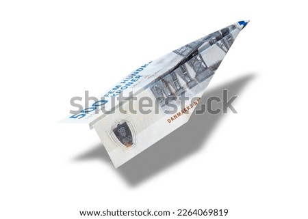 Money plane. Cash Danish Krone banknote folded into airplane isolated on white background. Express DKK money transfer or bank payment. Travel cost in Denmark.