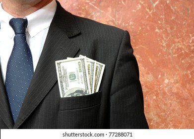 Money In The Pocket Of Business Suit