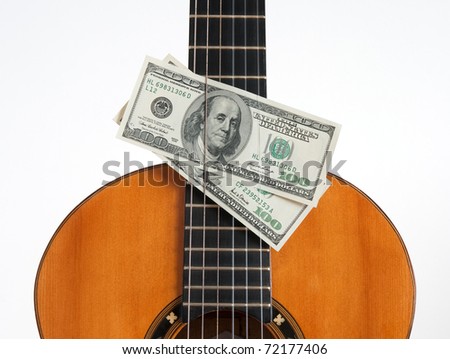 Money Put Between The Chords Of A Cl Ical Guitar Money Put Between The Chords Of A Cl Ical Guitar