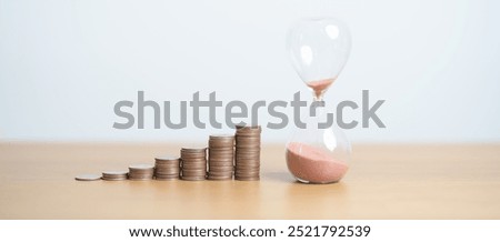 Money Saving for Future Plan, Retirement fund, Pension, Investment, Wealth Business and Financial concepts. hand putting coin on money stack with sandglass
