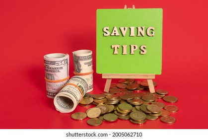 Money Saving Tips Concept. Selective Focus On The Green Board  With A Text Saving Tips. How To Save Money Fro Holiday, Paying Loan Or Investment Concept