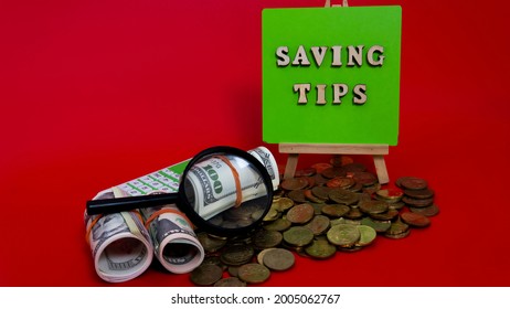 Money Saving Tips Concept. Selective Focus On The Green Board  With A Text Saving Tips. How To Save Money Fro Holiday, Paying Loan Or Investment Concept