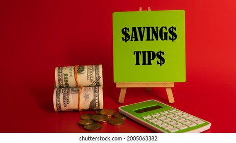 Money Saving Tips Concept. Selective Focus On The Green Board  With A Text Saving Tips. How To Save Money Fro Holiday, Paying Loan Or Investment Concept