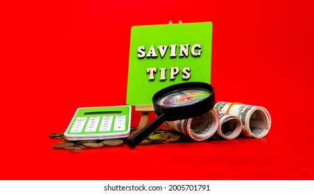 Money Saving Tips Concept. Selective Focus On The Green Board  With A Text Saving Tips. How To Save Money Fro Holiday, Paying Loan Or Investment Concept