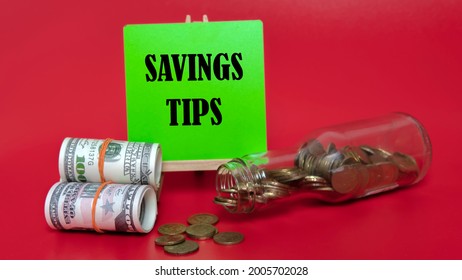 Money Saving Tips Concept. Selective Focus On The Green Board  With A Text Saving Tips. How To Save Money Fro Holiday, Paying Loan Or Investment Concept