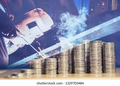 Money Stack As Growth Of Return Of Investment Chart, With Double Exposure With Industrial Worker Welding Metal Creates Smoke And Splashes, Business And Finance Concept.