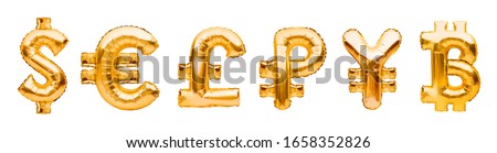 Money symbols made of golden balloons. Dollar, euro, pound, ruble, yen and bitcoin. Major monetary units of the world, currency symbols made of inflatable foil balloon. Investment and banking concept.
