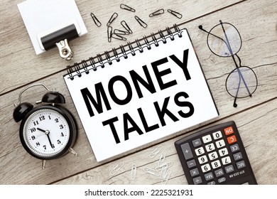 MONEY TALKS. notebook on the business table. text on the page. - Shutterstock ID 2225321931