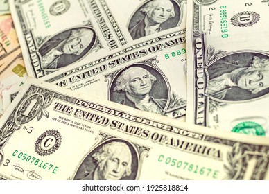 Money, US dollar banknotes background. One dollar banknotes in close-up. Photography for Finance and Economy concept. Photograph with aged color tone.

