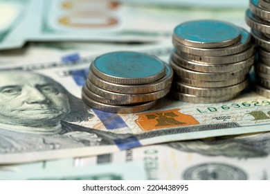 Money, US Dollar Bills Background. Paper Money Is Scattered On The Table With Silver Coins. Photo For Finance And Economics Concepts.