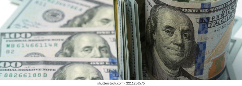 Money, US Dollar Bills Background. Paper Money Is Scattered On The Table With Silver Coins. Photo For Finance And Economics Concepts.