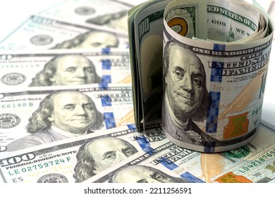 Money, US Dollar Bills Background. Paper Money Is Scattered On The Table With Silver Coins. Photo For Finance And Economics Concepts.