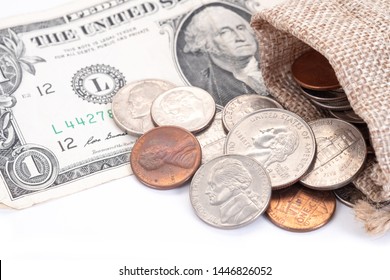 Money, US Dollars Bank Notes, Penny, Nickel, Dime, Quarter On A White Background.