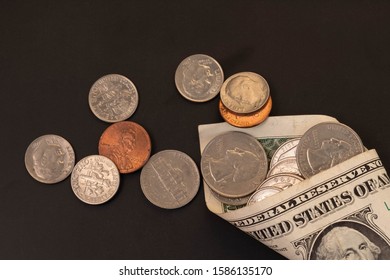 Money, US Dollars Bank Notes, Penny, Nickel, Dime, Quarter On Black Background. Finance And Economy Concept.