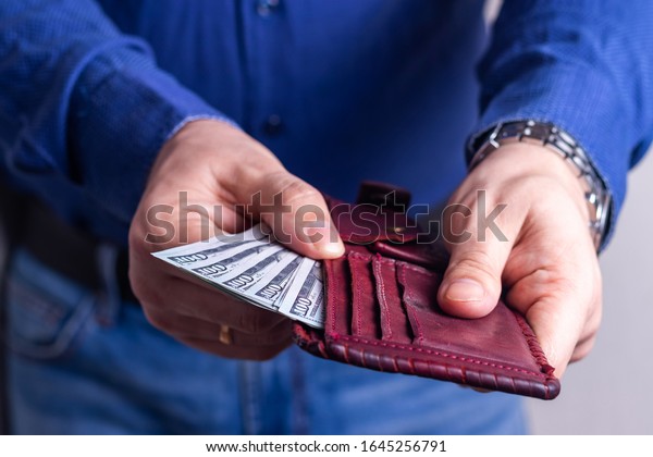 Money in the wallet of\
a successful man