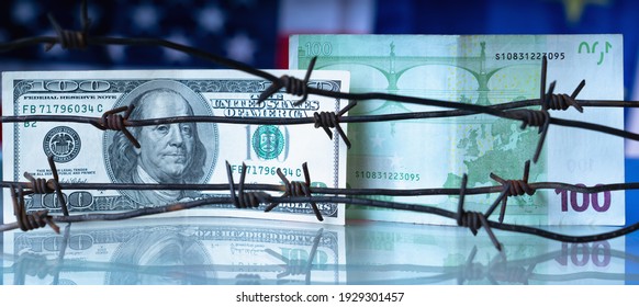 Money Wrapped In Barbed Wire Against United States And European Union Flags As Symbol Of Joint Economic Warfare, Sanctions And Embargo Busting