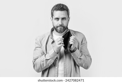 moneyless guy with empty wallet in studio. moneyless guy with wallet at hand.