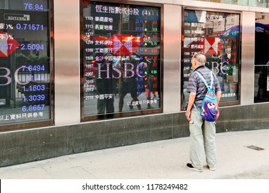 Mong kok Hong Kong - September 11, 2018 : People look at an electronic stock board