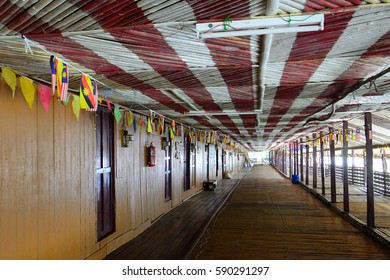 MONGKOS - FEBRUARY 20: Bidayuh Longhouse On 20 February 2017 At Mongkos. The Bidayuh, Tribe Of Dayaks Are Living Together In Wooden Longhouses.