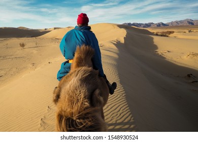 Mongolian Nomad Ride Camel In Gobi Desert