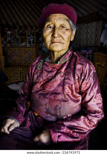 Mongolian woman in\
traditional dress.