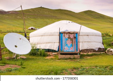 Mongolian yurt or ger with satellite dish on grassy steppe of central Mongolia - Powered by Shutterstock