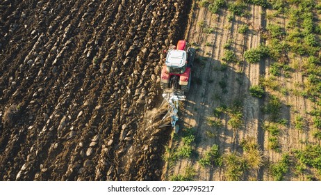 Monitcelli, Italy PC - September 2022 Tractor plowing the land in the fields - Shutterstock ID 2204795217