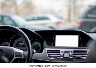 Monitor In Car With Isolated Blank Screen Use For Navigation Maps And GPS. Isolated On White With Clipping Path. Car Detailing.  Mock Up. Car Display With Blank Screen. Modern Car Interior Details.