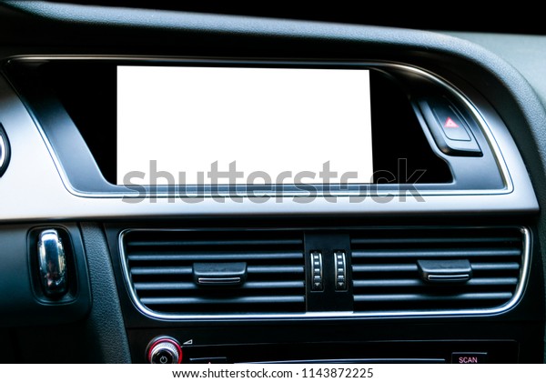 Monitor in car with isolated blank
screen use for navigation maps and GPS. Isolated on white with
clipping path. Car detailing. Modern car interior
details.