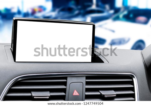 Monitor in car with isolated blank\
screen use for navigation maps and GPS. Isolated on white with\
clipping path. Car detailing. Modern car interior details.\
