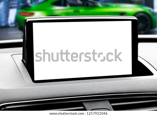Monitor in car with isolated blank\
screen use for navigation maps and GPS. Isolated on white with\
clipping path. Car detailing. Modern car interior details.\
